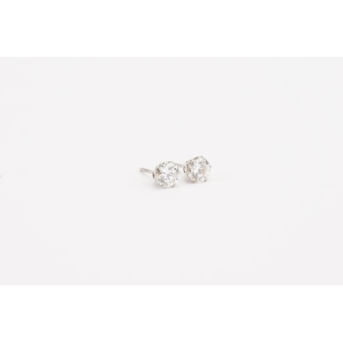 86 - A pair of brilliant cut diamond earrings, approximately 0.7ct each. Weight without backs 1g.