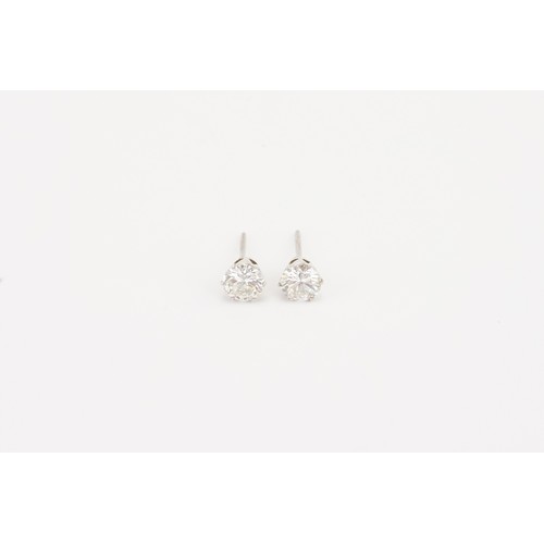 86 - A pair of brilliant cut diamond earrings, approximately 0.7ct each. Weight without backs 1g.