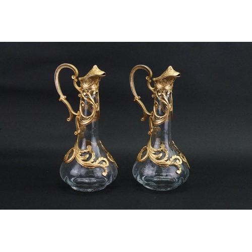 186 - A pair of Cristallin boussu souffle bouche glass decanters, decorated with gold gilt.