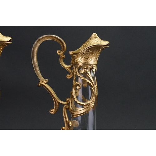 186 - A pair of Cristallin boussu souffle bouche glass decanters, decorated with gold gilt.