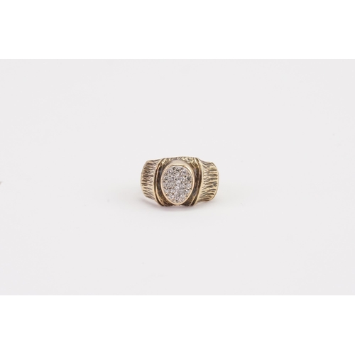 81 - A 9ct gold and diamond set ring, decorated in the bark design. Weight 5.6g. Size L.