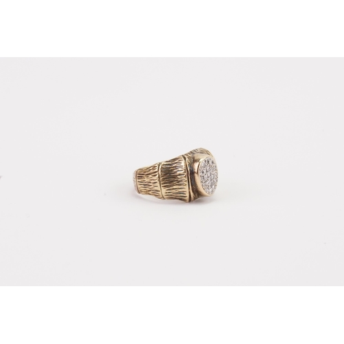 81 - A 9ct gold and diamond set ring, decorated in the bark design. Weight 5.6g. Size L.