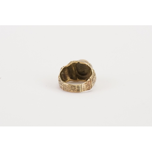 81 - A 9ct gold and diamond set ring, decorated in the bark design. Weight 5.6g. Size L.