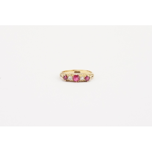 70 - A 18ct gold ruby and diamond set ring. Largest ruby approximately 0.21ct. Weight 3g. Size N.