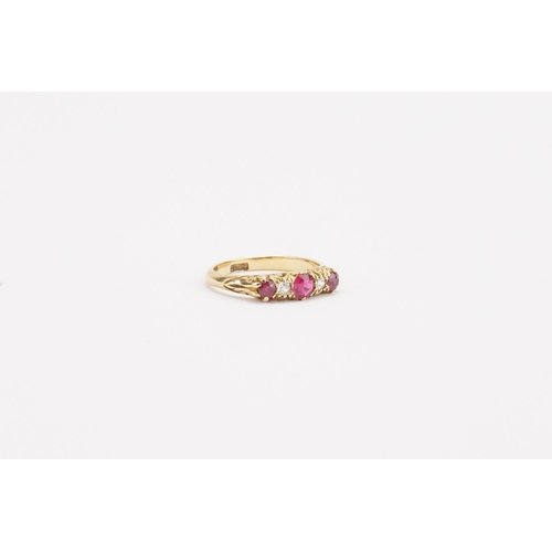 70 - A 18ct gold ruby and diamond set ring. Largest ruby approximately 0.21ct. Weight 3g. Size N.