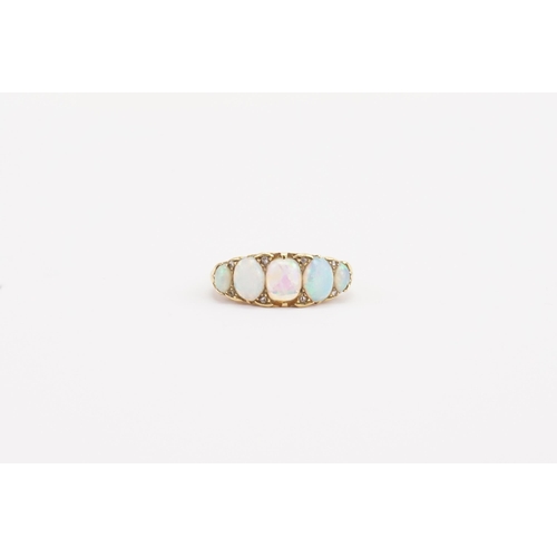 73 - A 18ct gold opal set ring, set with 5 opals. Weight 6.1g. Size P.