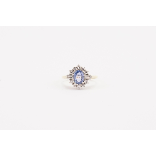 141 - A 18ct gold pale sapphire and diamond set ring, set with two baguette diamond shoulders (0.06ct) and... 