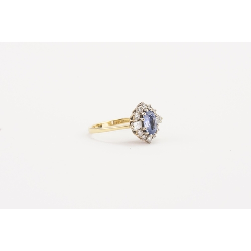 141 - A 18ct gold pale sapphire and diamond set ring, set with two baguette diamond shoulders (0.06ct) and... 