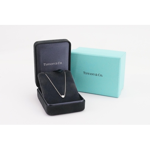 145 - A platinum Tiffany & Co Pertti diamond set necklace. Set with a single 0.2ct diamond. In original bo... 