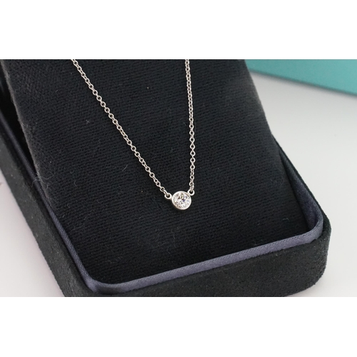 145 - A platinum Tiffany & Co Pertti diamond set necklace. Set with a single 0.2ct diamond. In original bo... 