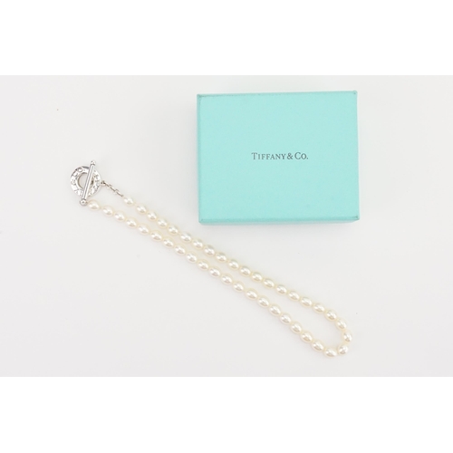 146 - A Tiffany & Co set of pearls, with the traditional Tiffany & Co clasp. In original box.