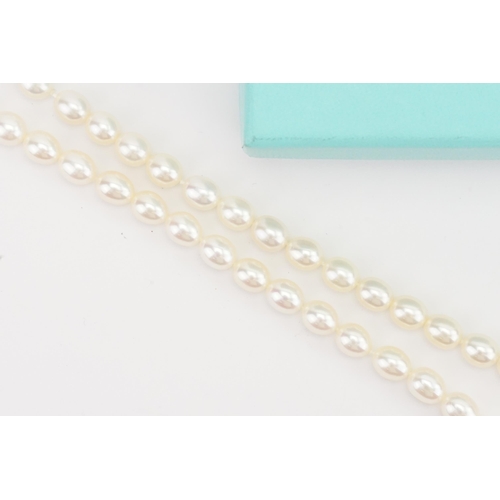 146 - A Tiffany & Co set of pearls, with the traditional Tiffany & Co clasp. In original box.