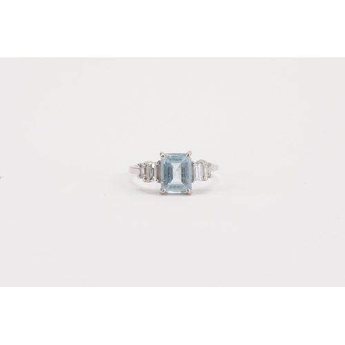 75 - A 18ct white gold Aquamarine and diamond set ring, set with an emerald cut aquamarine 8.9mm x 6.8mm.... 