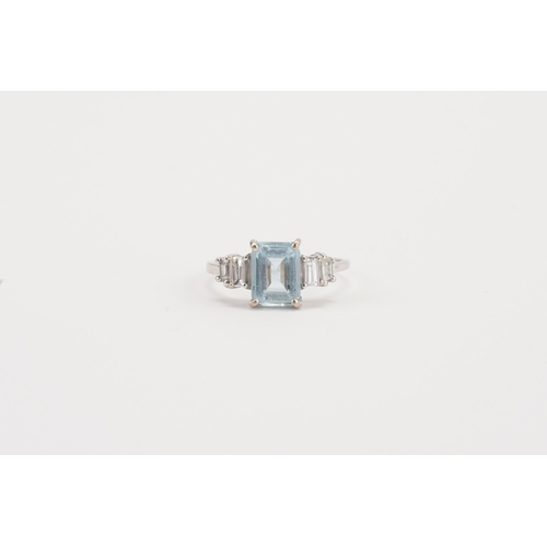 75 - A 18ct white gold Aquamarine and diamond set ring, set with an emerald cut aquamarine 8.9mm x 6.8mm.... 