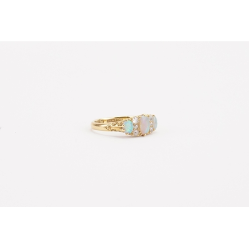 90 - A 18ct gold opal and diamond set ring. Set with three opals and six diamonds. Weight 4.2g. Size P. T... 