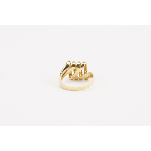 101 - A 18ct gold diamond set ring, in the coil design. Weight 5.3g. Size N.