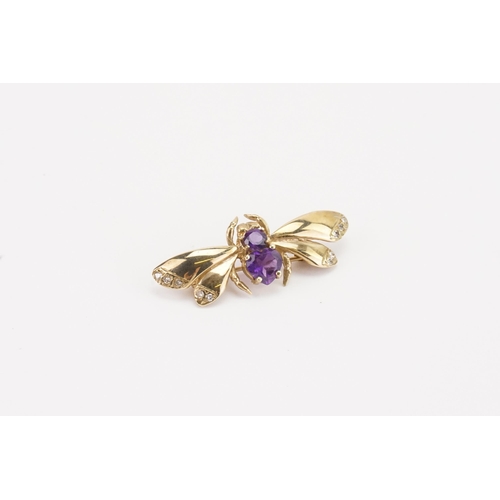 107 - A 9ct gold amethyst and diamond insect brooch, set with a heart shaped amethyst and a brilliant cut ... 