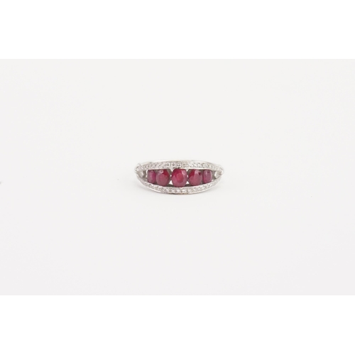 109 - A stunning 18ct white gold diamond and ruby set ring, set with five rubies, largest approximately 3.... 