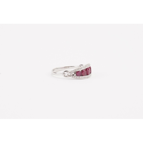 109 - A stunning 18ct white gold diamond and ruby set ring, set with five rubies, largest approximately 3.... 