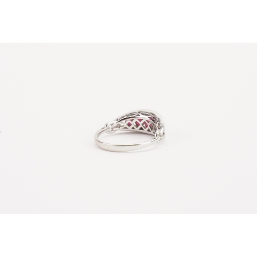 109 - A stunning 18ct white gold diamond and ruby set ring, set with five rubies, largest approximately 3.... 