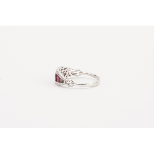 109 - A stunning 18ct white gold diamond and ruby set ring, set with five rubies, largest approximately 3.... 