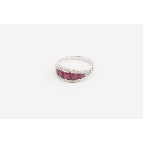 109 - A stunning 18ct white gold diamond and ruby set ring, set with five rubies, largest approximately 3.... 