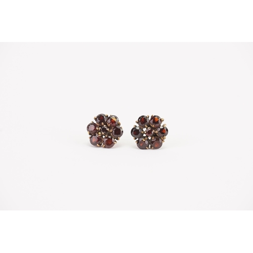 149 - A Pair of Yellow Metal Garnet Flower Earrings, Tests as 9ct Gold. Total Weight: 3.2 Grams.