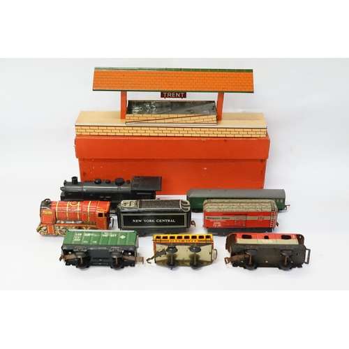 274 - A Collection of Trains to include a Boxed Hornby O Gauge Train Station 