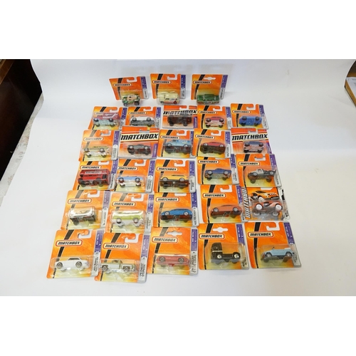 351 - A Collection of 28 x 2005 to 2011 Matchbox Cars, Vans, Trucks, etc. All Mint & Boxed.