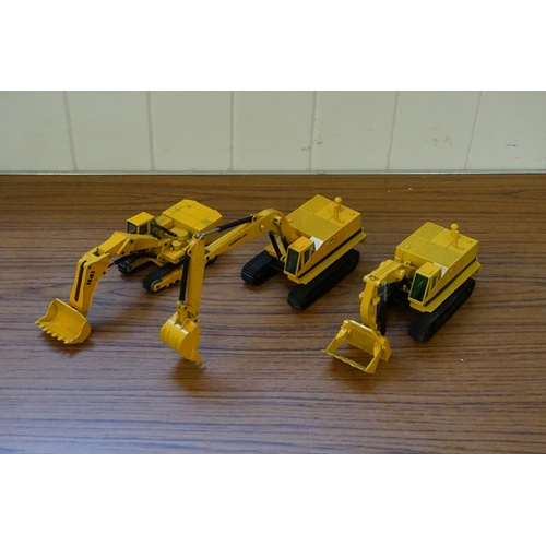 129 - Three unboxed NZG Excavators in Yellow. All in Excellent Original Condition.