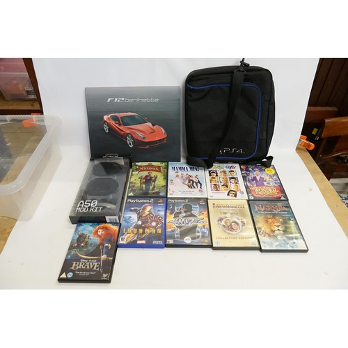 448 - A Play station 4 bag, play station 4 games, DVDs, Ferrari book etc.