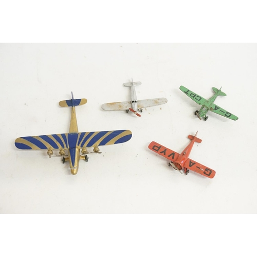 71 - A Collection of Four Dinky Pre-War Tin Plated Winged Planes in Good/Near Mint Original Conditions.