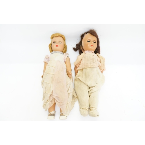 434 - Two Vintage Dolls dressed in period clothes. Measuring: 54cms Tall.