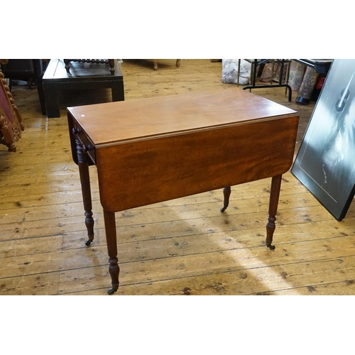 575 - A Late 19th Century Mahogany Pembroke Table fitted a Single Drawer resting on turned legs & Brass Ca... 