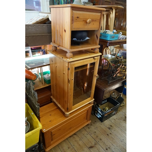 614 - A Bedside Table, a Glass Wooden Unit and a Coffer all in a Light Wood.