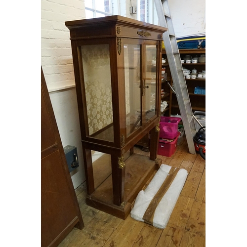 566 - A Mahogany Glass Cabinet. Measuring: 108cms across x 45cms deep x 169cms high.