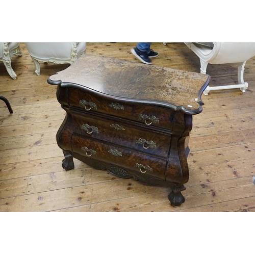 569 - A Plum Pudding Veneered Dutch Chest of Bombe Front, Serpentine Top & Resting on Carved Feet. Measuri... 