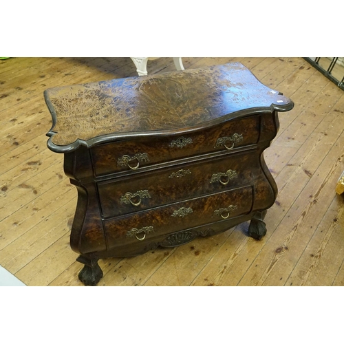 569 - A Plum Pudding Veneered Dutch Chest of Bombe Front, Serpentine Top & Resting on Carved Feet. Measuri... 