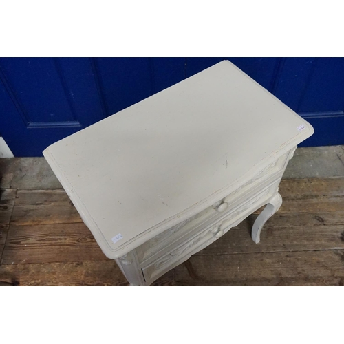 603 - A Cream painted Two Drawers Bedside Table. Measuring: 58cms across x 36cms deep x 66cms high.