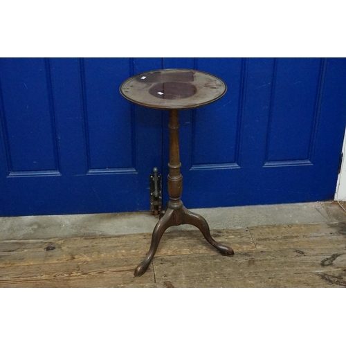 604 - A Mahogany Tripod Wine Table. Measuring: 38cms across x 72cms High.