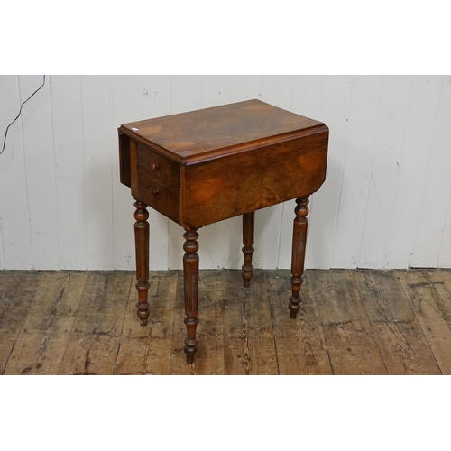 595 - A Victorian Walnut veneered Bedside Table with a drop door & resting on turned fluted legs. Measurin... 