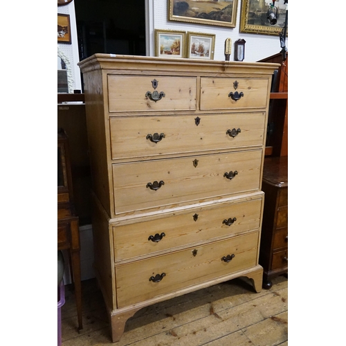 585 - A Pine Tallboy Chest fitted with graduated drawers, Brass Handles & resting on Bracket Feet. Measuri... 