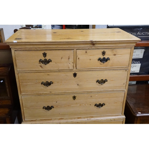 585 - A Pine Tallboy Chest fitted with graduated drawers, Brass Handles & resting on Bracket Feet. Measuri... 