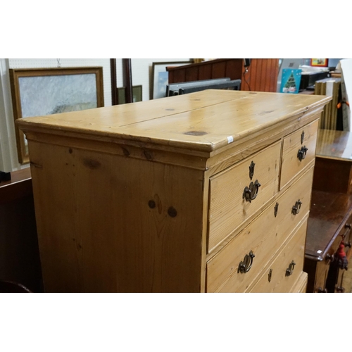 585 - A Pine Tallboy Chest fitted with graduated drawers, Brass Handles & resting on Bracket Feet. Measuri... 