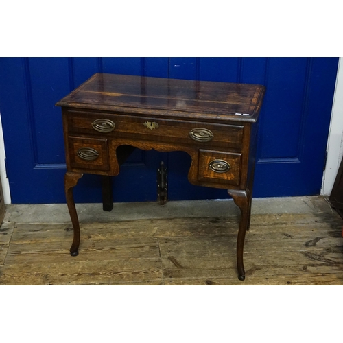 584 - A Georgian design Oak & Banded Low Boy fitted with Drawers & resting on Shaped Pad Feet. Measuring: ... 