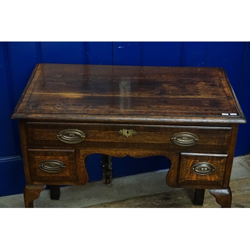 584 - A Georgian design Oak & Banded Low Boy fitted with Drawers & resting on Shaped Pad Feet. Measuring: ... 