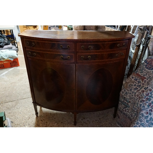 588 - A Mahogany Veneered Bow Fronted Sideboard with Four Drawers over Two Doors. Measuring: 107cms across... 