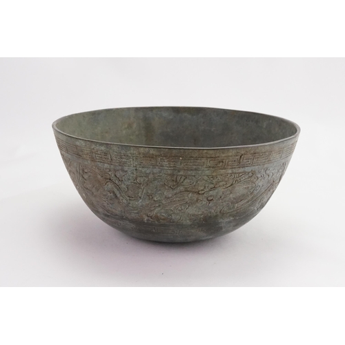 835 - A Japanese Cast Dragon & Phoenix in a Greek Key pattern Offering Bowl. Measuring: 25cms across x 12c... 