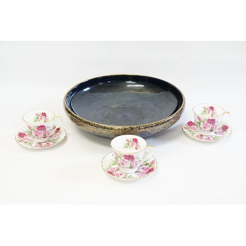 724 - A Blue Glazed Gold Burnished Floral decorated Centre Bowl. Measuring: 38cms across. Along with Three... 