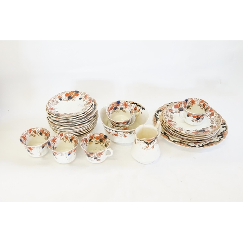736 - A quantity of Rust Blue & Brown Edwardian Dinner China.
